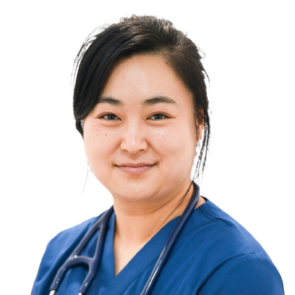 Female healthcare professional in blue medical scrubs with stethoscope